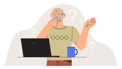 a man looks confused as he works on a computer